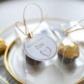 czekoladki na komunię - podziękowania na przyjęcie komunijne ferrero rocher w złotej oprawie - zawieszka z imieniem dziecka
