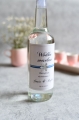 zimowa naklejka na wódkę weselną ze srebrną gwiazdką - etykieta na alkohol z imionami Pary młodej i datą