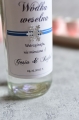 zimowa naklejka na wódkę weselną ze srebrną gwiazdką - etykieta na alkohol z imionami Pary młodej i datą